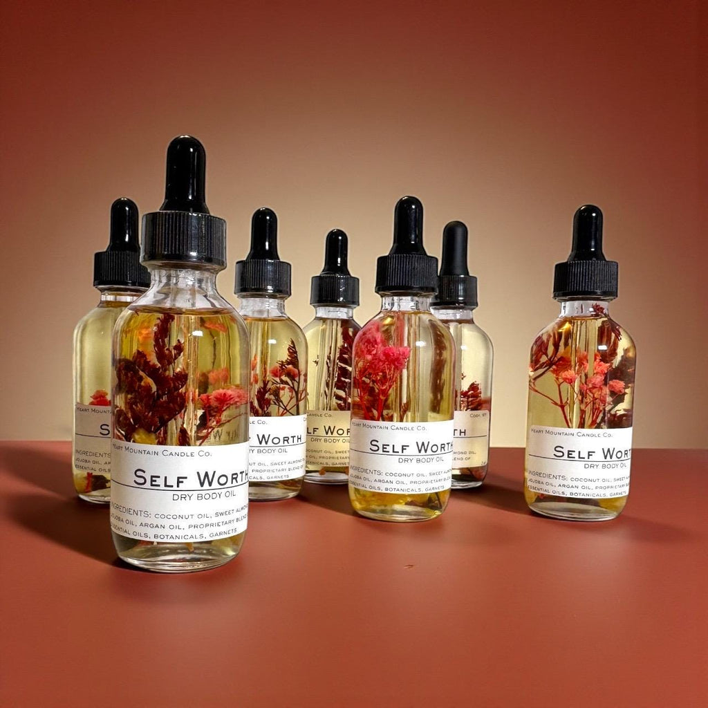 self-worth body oil christmas gift stocking stuffer wellness gift gift for her self-care gift encouragement gift luxury body oil dry body oil non-greasy body oil crystal infused body oil garnet body oil hydrating skincare glowing skin oil frankincense cedarwood body oil handcrafted skincare cody wyoming luxury spa oil grounding skincare intentional living gift