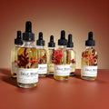 self-worth body oil christmas gift stocking stuffer wellness gift gift for her self-care gift encouragement gift luxury body oil dry body oil non-greasy body oil crystal infused body oil garnet body oil hydrating skincare glowing skin oil frankincense cedarwood body oil handcrafted skincare cody wyoming luxury spa oil grounding skincare intentional living gift