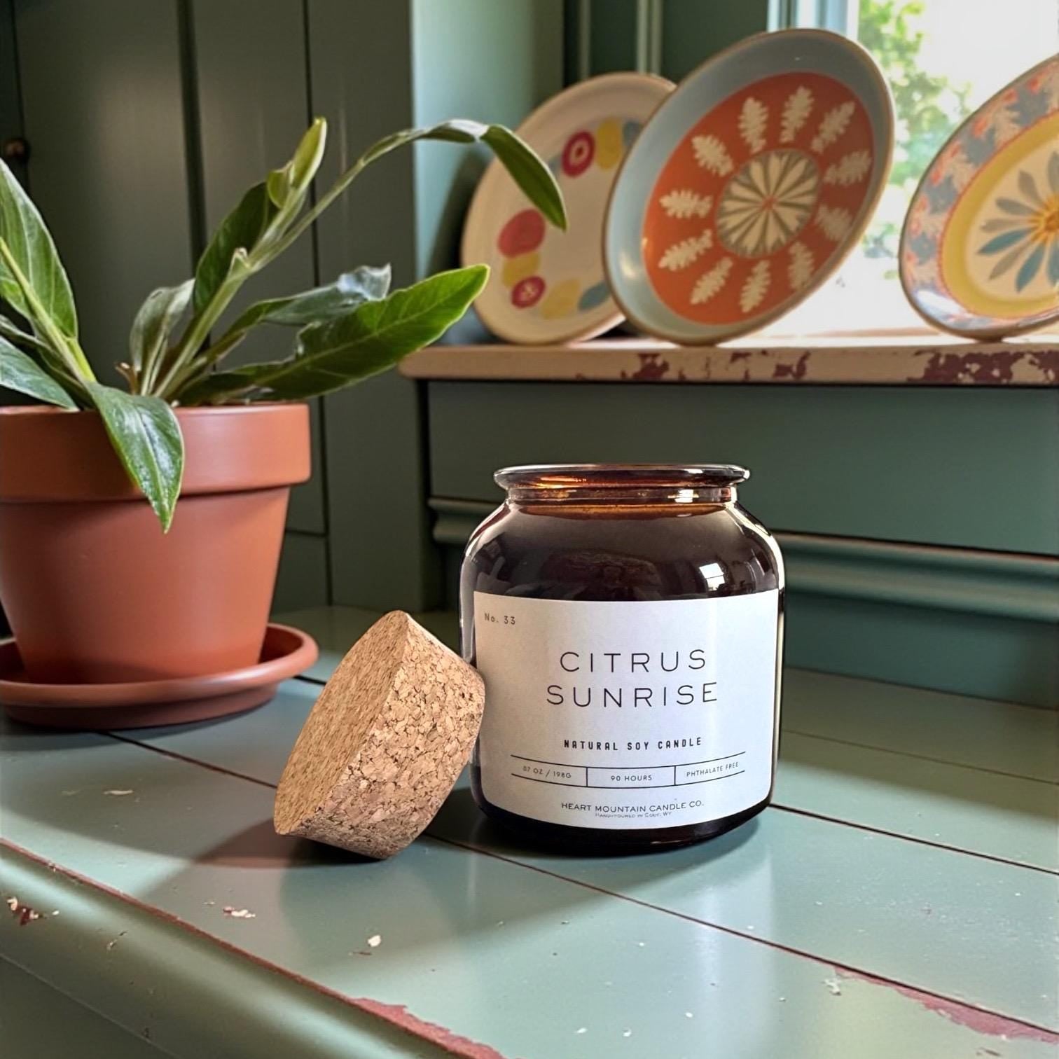 citrus sunrise soy candle luxury candle teacher appreciation gift teacher gift daycare teacher gift end of school gift graduation gift thank you gift coworker gift office gift boss gift nurse gift relaxing candle clean burning candle amber apothecary candle citrus pomegranate candle wellness candle self-care candle fresh candle thoughtful candle modern home fragrance candle hand poured wyoming candle uplifting luxury candle energizing candle