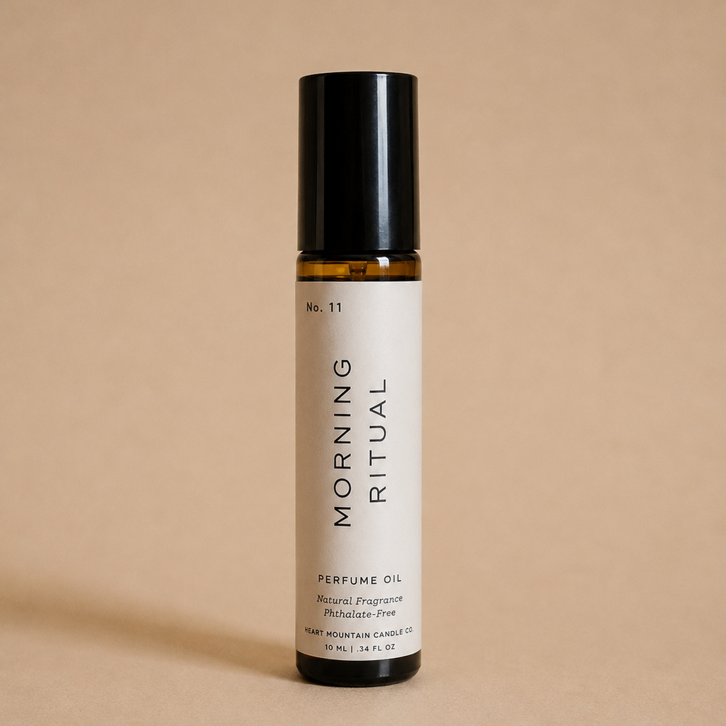 A Morning Ritual perfume oil rollerball bottle on a beige background.