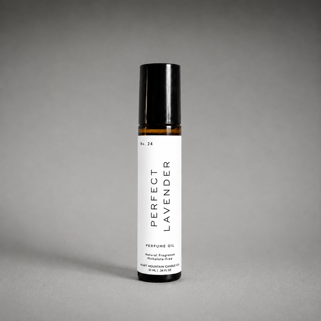 A Perfect Lavender perfume oil rollerball bottle on a gray background.