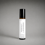 A Perfect Lavender perfume oil rollerball bottle on a gray background.