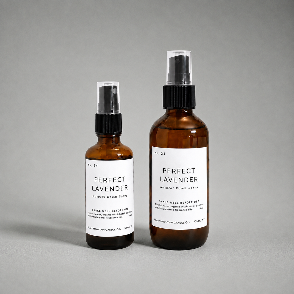 Two Perfect Lavender room spray bottles in different sizes on a gray background.