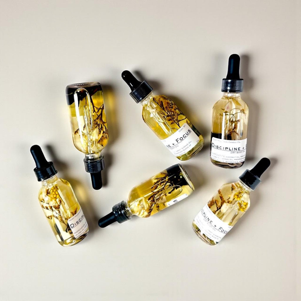 discipline and focus body oil christmas gift stocking stuffer wellness gift gift for him gift for her graduation gift teacher appreciation gift mens body oil womens body oil rosemary body oil lightweight dry body oil non-greasy body oil crystal infused body oil hematite body oil hydrating skincare glowing skin oil self-care gift herbal body oil handcrafted skincare cody wyoming luxury spa oil