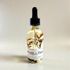 hematite body oil housewarming gift realtor closing gift hostess gift birthday gift anniversary gift mens skincare gift fathers day gift boyfriend gift husband gift luxury body oil herbal body oil grounding skincare non-toxic body oil hydrating dry oil rosemary clove body oil spa inspired skincare crystal infused body oil elegant wellness gift handcrafted botanical skincare smooth skin oil