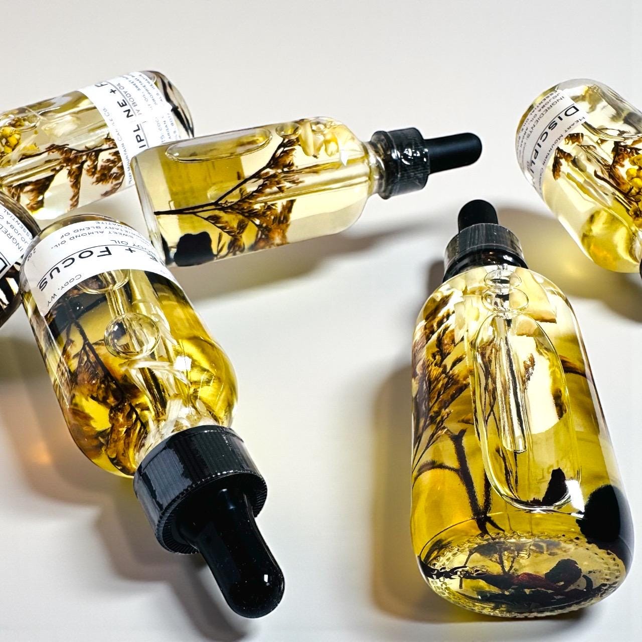 discipline and focus body oil black friday gift cyber monday gift christmas skincare stocking stuffer beauty gift luxury spa gift mens gift womens gift office exchange gift herbal body oil botanical skincare hydrating dry oil glowing skin product crystal body oil handcrafted skincare rosemary clove body oil grounding self-care product cody wyoming skincare wellness gift