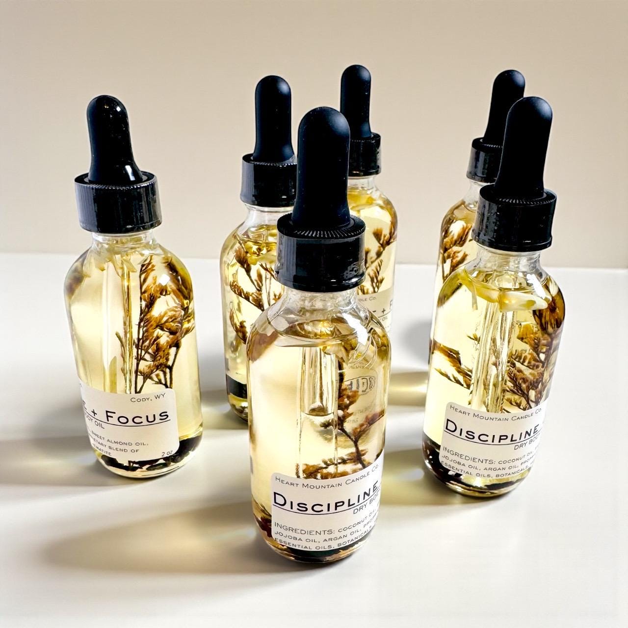 hematite dry body oil college graduation gift realtor client gift retirement gift bridal party gift thank you gift appreciation gift luxury skincare gift spa lover gift self-care gift lightweight botanical body oil hydrating skincare glowing skin body oil rosemary lemon skincare crystal infused body oil handcrafted wellness product grounding skincare smooth soft skin luxury body oil