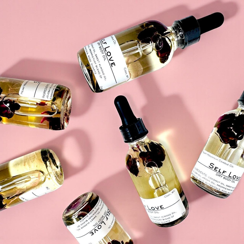 rose quartz body oil self-love gift christmas gift stocking stuffer spa gift gift for her birthday gift valentines day gift mothers day gift bridesmaid gift luxury body oil dry body oil non-greasy body oil botanical body oil crystal infused body oil rose quartz oil hydrating body oil glowing skin oil self-care gift wellness gift romantic body oil handcrafted skincare cody wyoming luxury spa oil