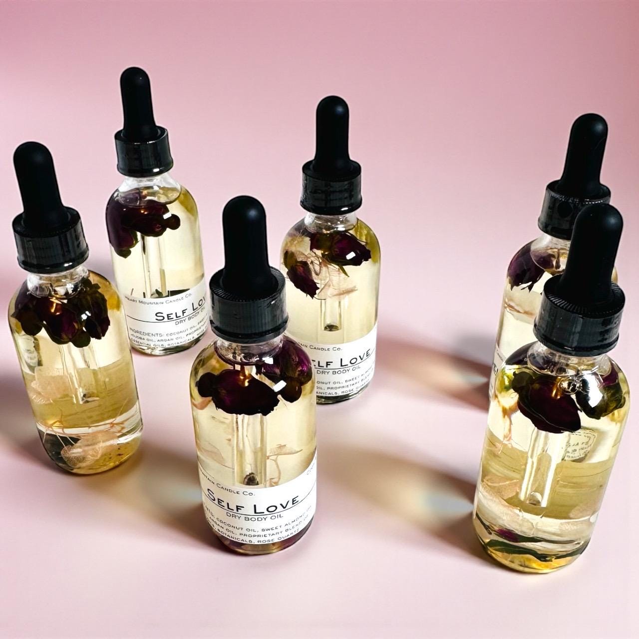 rose quartz dry body oil black friday gift cyber monday gift christmas skincare stocking stuffer beauty gift luxury spa gift womens gift office exchange gift birthday party gift wellness gift body shimmer alternative botanical body oil luxury body care hydrating skincare glowing body oil soft skin oil crystal body oil handcrafted skincare romantic body oil cody wyoming skincare