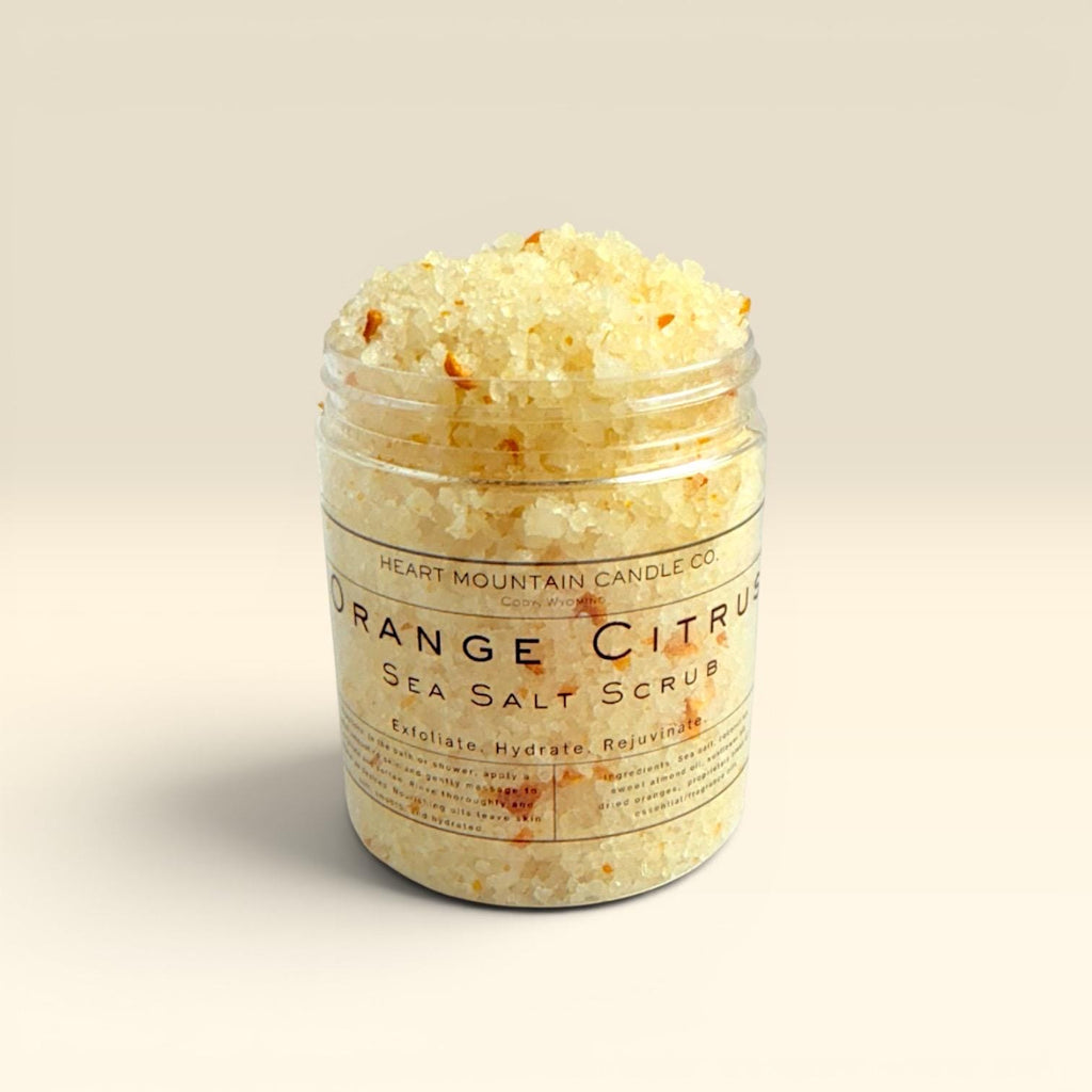 orange exfoliating body scrub sea salt body polish natural skincare hydrating body exfoliator self care spa gift glowing skin exfoliating treatment coarse salt scrub sweet almond oil coconut oil sunflower oil nourishing body care skin smoothing exfoliation citrus skincare body care routine spa gift idea bath and shower exfoliating scrub smooth soft glowing skin