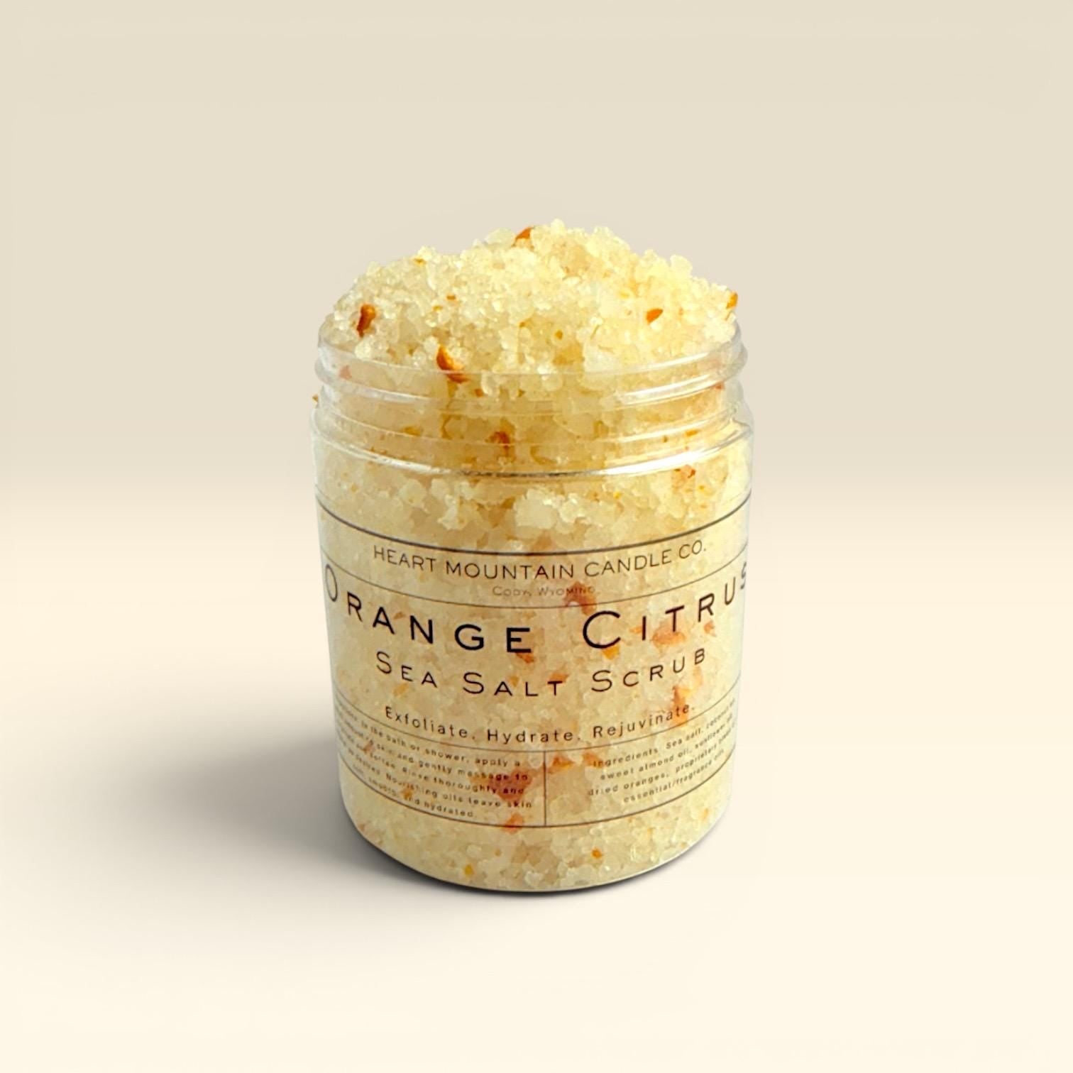 orange exfoliating body scrub sea salt body polish natural skincare hydrating body exfoliator self care spa gift glowing skin exfoliating treatment coarse salt scrub sweet almond oil coconut oil sunflower oil nourishing body care skin smoothing exfoliation citrus skincare body care routine spa gift idea bath and shower exfoliating scrub smooth soft glowing skin
