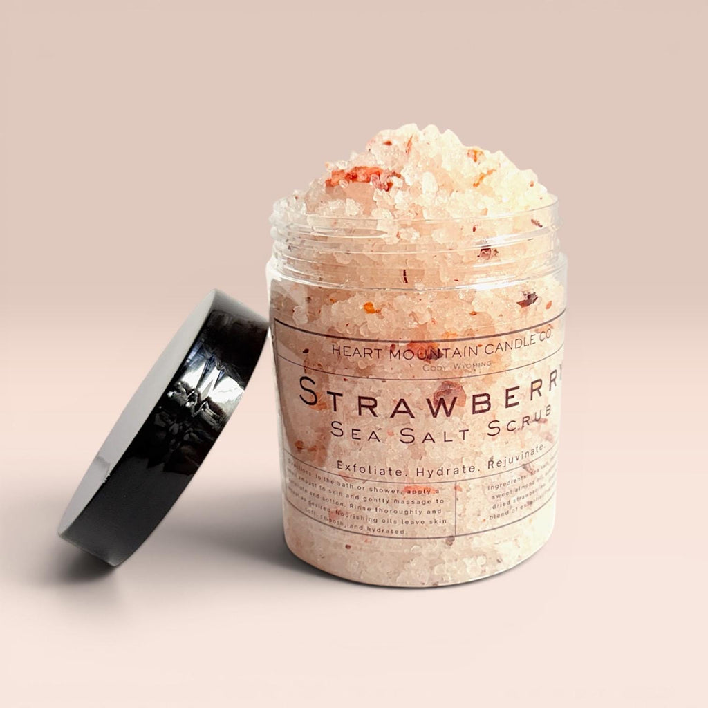 natural strawberry body scrub sea salt exfoliating scrub hydrating body polish self care gift for women spa body treatment skin smoothing exfoliator glowing skin routine coarse salt scrub almond oil coconut oil sunflower oil body scrub nourishing exfoliating skincare strawberry scrub bath routine relaxing spa gift body care product soft smooth skin exfoliation treatment